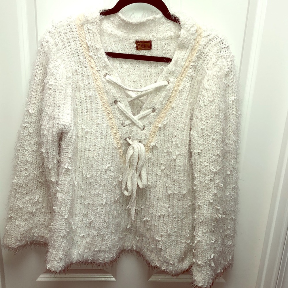Beautiful fuzzy sweater with lace up neckline